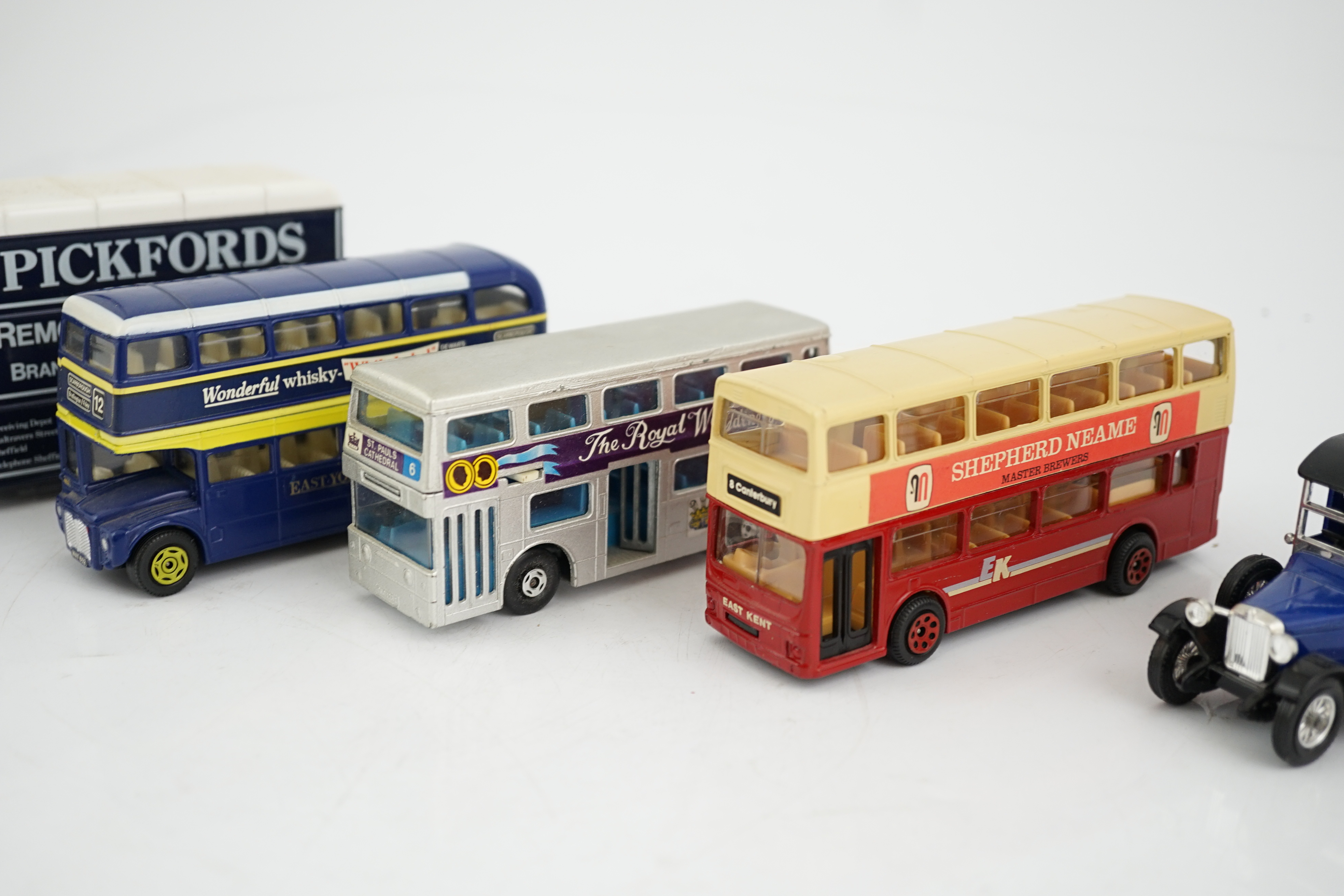 Thirty-six boxed diecast vehicles by Vanguard, Atlas Dinky, Revell, etc. including; cars, commercial vehicles, police cars, TV related cars, an Action 1:32 scale UPS van, four Jet Age military aircraft, etc. together wit